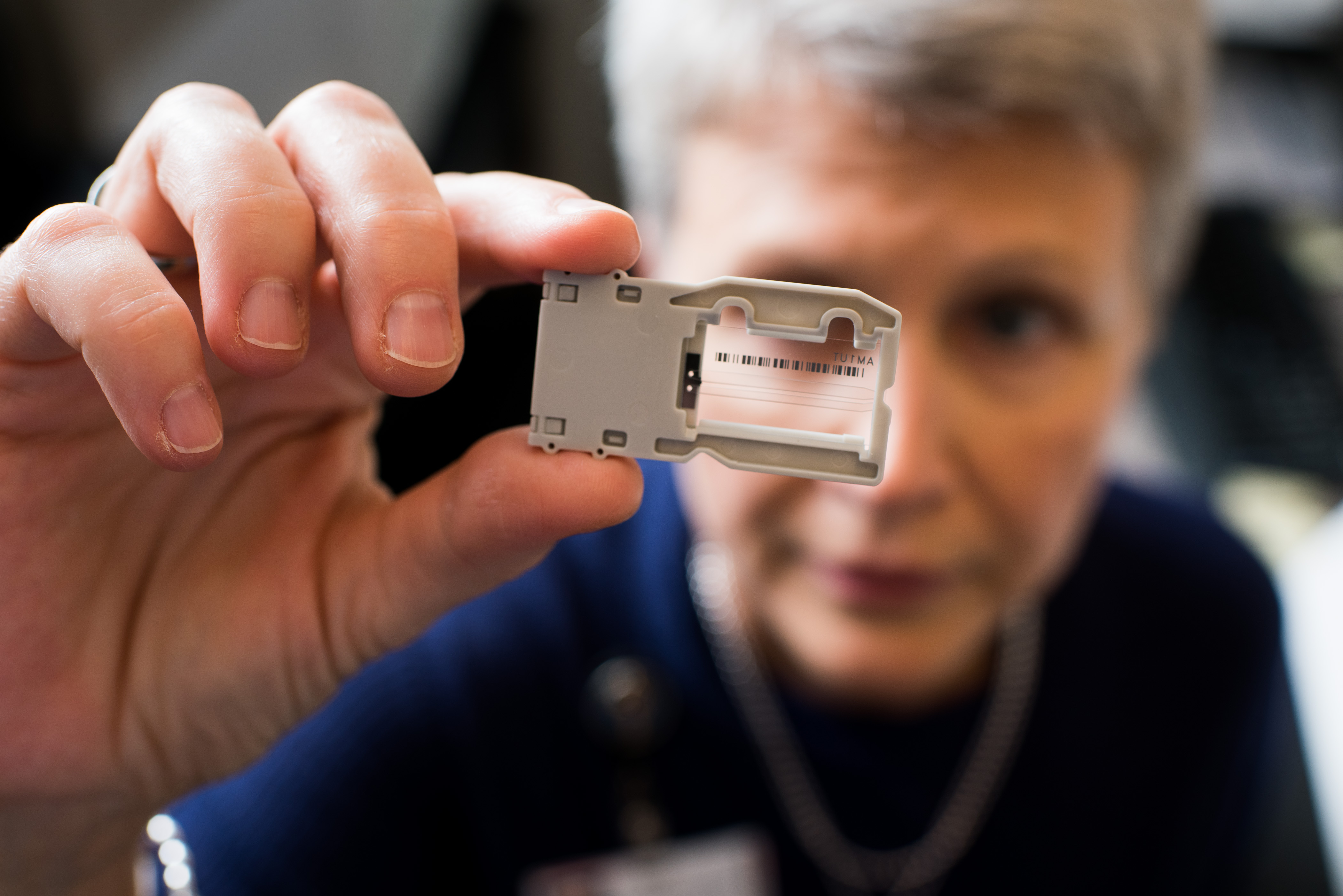 Debra Leonard looking at a Covid-19 lab test