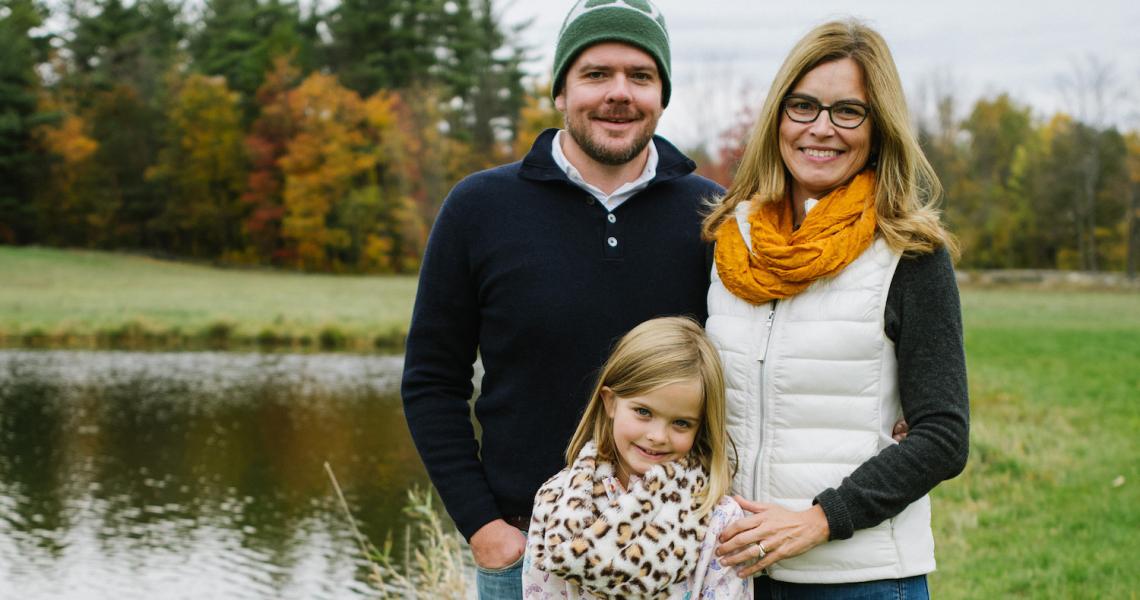 Houskeeper family by a pond.