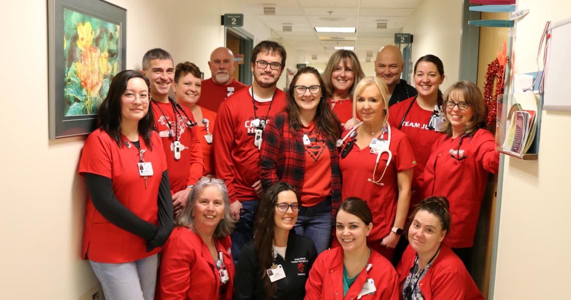 CVPH staff pose for group photo wearing red