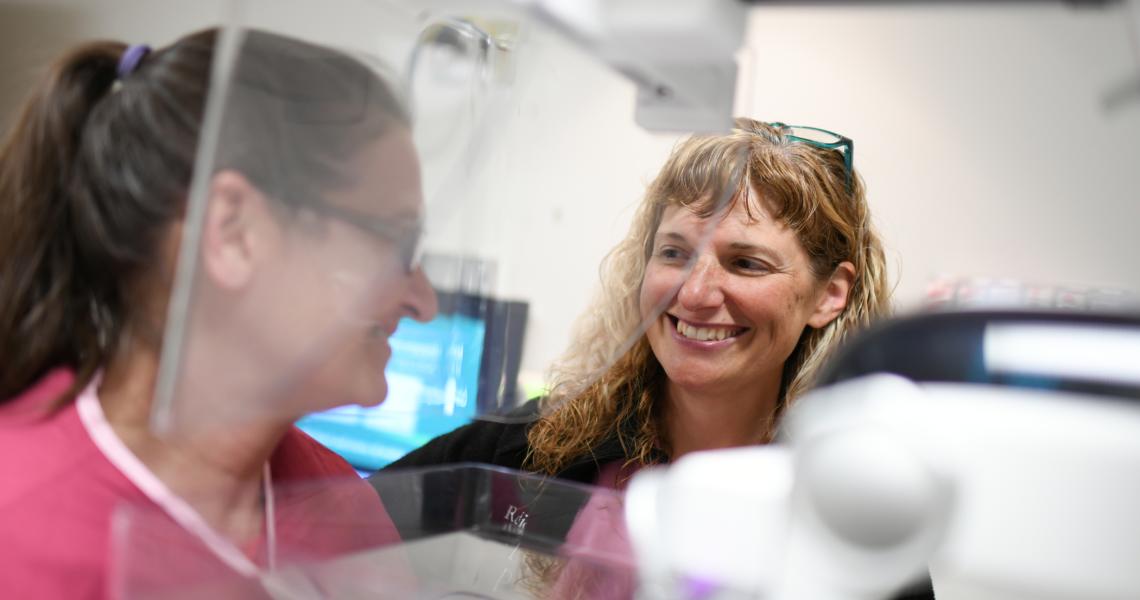 UVM Health Network provider performs mammogram on patient.