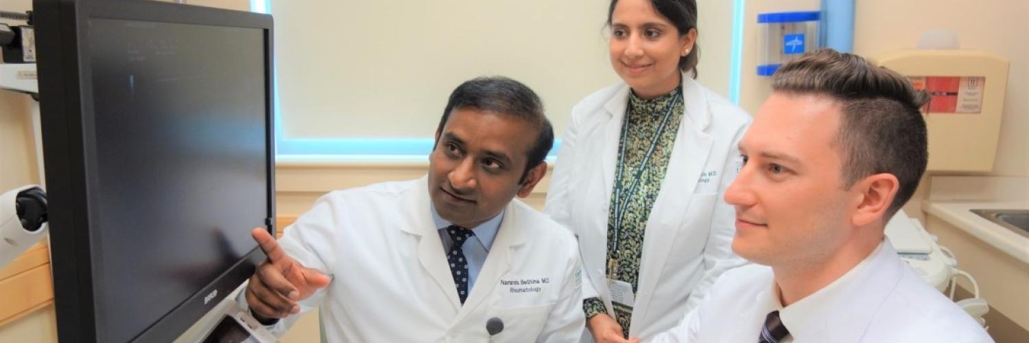 Three UVM Medical Center Rheumatology fellows working.