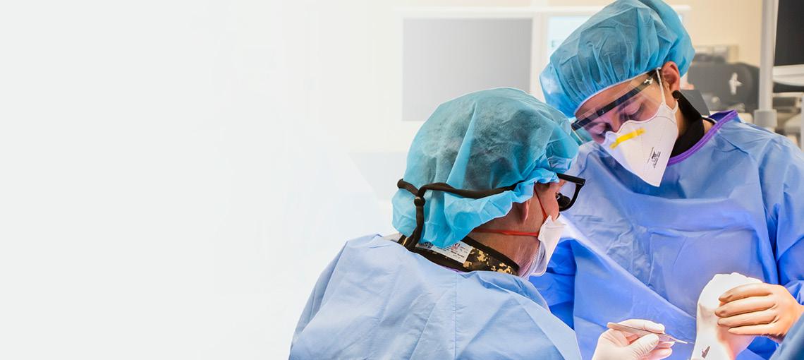 Surgeons operating on a wrist