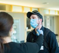 Hospital visitor getting screened for covid-19 symptoms