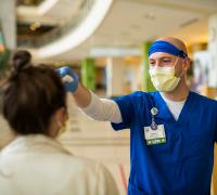 Hospital visitor getting screened for covid-19 symptoms