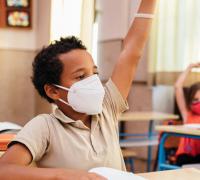 Children in classroom wearing masks