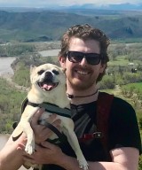 Loften Fansler, DO hiking with his dog in the summer. 