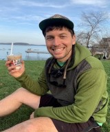 Ryan Dwosh, DO eating ice cream on the waterfront.
