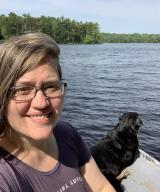 Ruth on the lake with dog