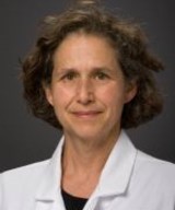 Headshot of Dr. Marjorie Meyer wearing her labcoat