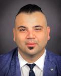 Headshot of Dragos Banu, MD physician at the UVM Medical Center.