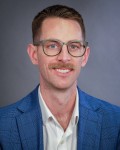 Headshot of Cameron Upchurch, MD.