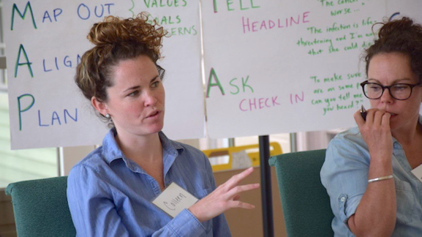 Hospice & Palliative Medicine interdisciplinary team in discussion at workshop