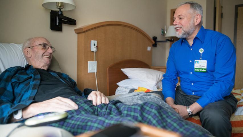 UVM Medical Center social worker in discussion with patient. 
