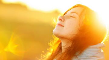 Woman standing in the sun.