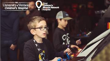 UVMMC Children's Hospital Extra Life promo Image featuring two young boys playing arcade games.