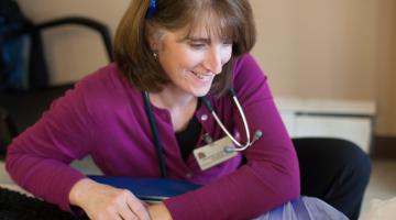UVM Medical Center Primary Care provider working at a desktop.